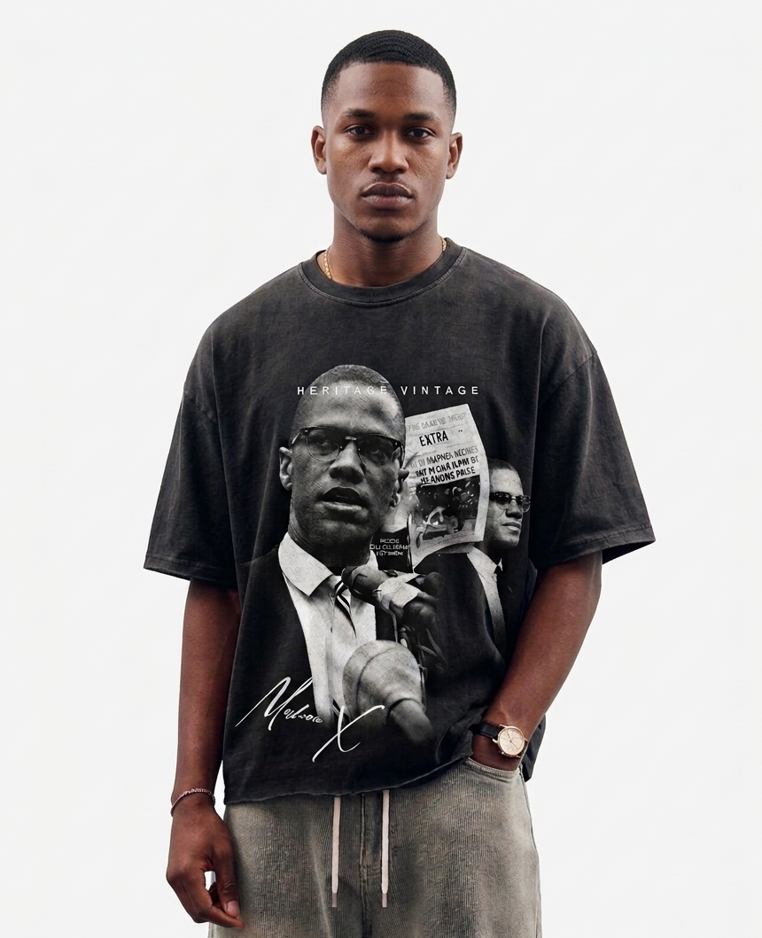 Man wearing a t-shirt with a graphic design on a plain background